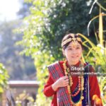 a girl with Gurung traditional dressing a Gurung village in Ghandruk town, Gandaki Province of Nepal, is a point of Annapurna circuit trek and Poonhill trekking in Nepal